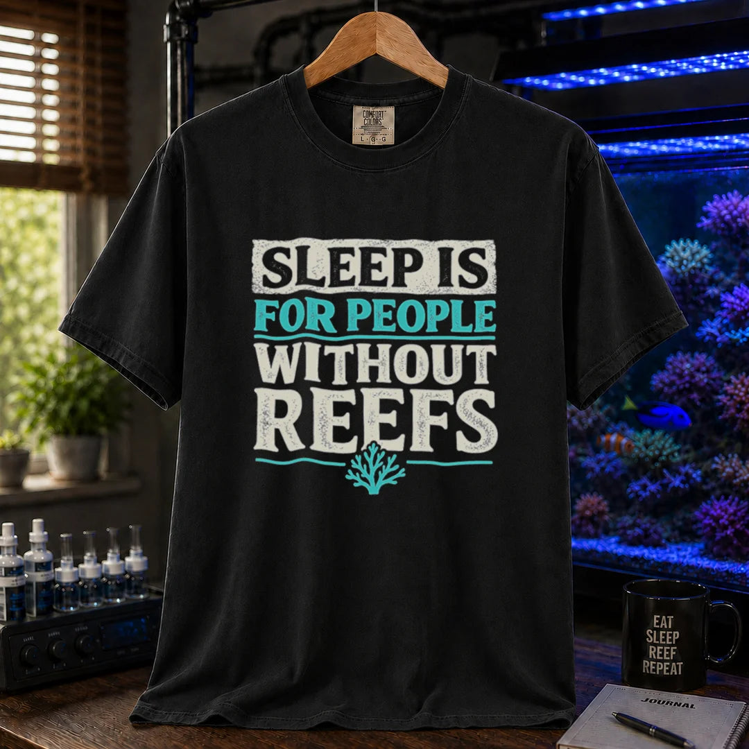 Saltwater aquarium graphic t-shirt featuring distressed typography reading Sleep Is For People Without Reefs with a coral icon on a black shirt