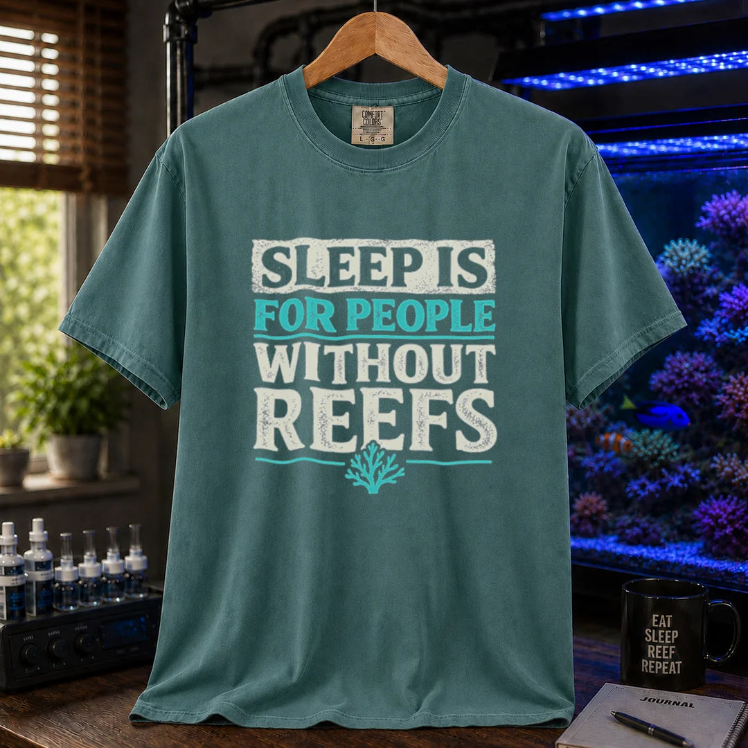 Saltwater aquarium graphic t-shirt featuring distressed typography reading Sleep Is For People Without Reefs with a coral icon on a green shirt
