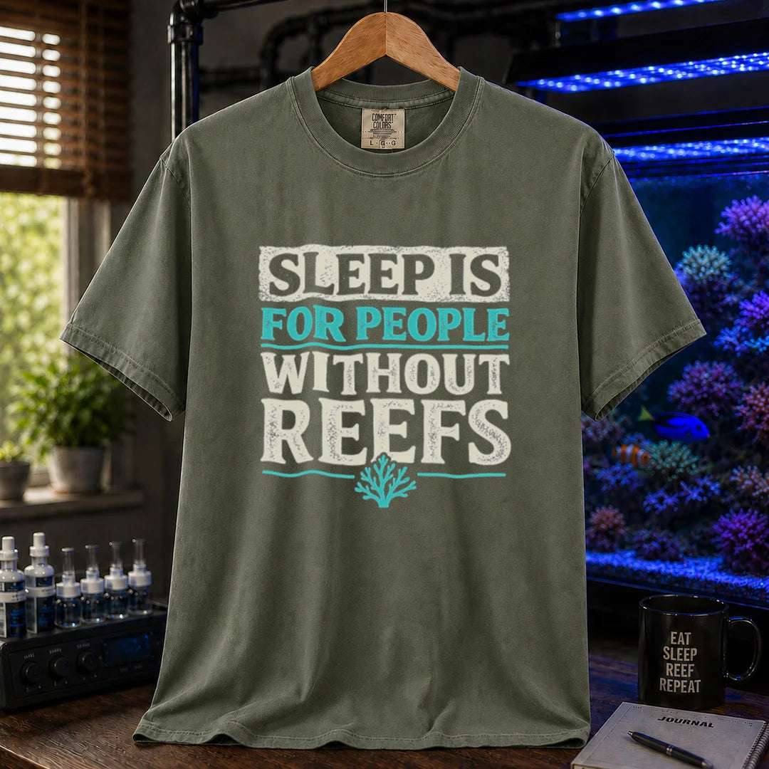 Saltwater aquarium graphic t-shirt featuring distressed typography reading Sleep Is For People Without Reefs with a coral icon on a military green shirt