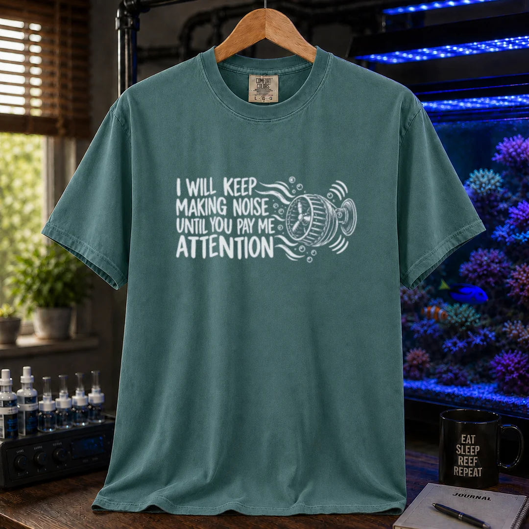 Saltwater aquarium graphic t-shirt featuring distressed typography reading I Will Keep Making Noise Until You Pay Me Attention with an aquarium wavemaker pump illustration on a green shirt