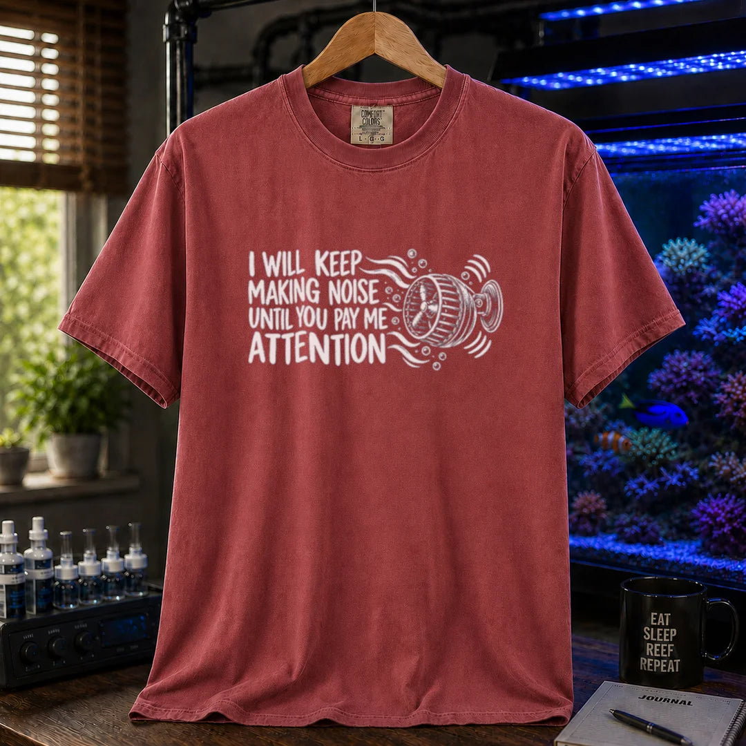 Saltwater aquarium graphic t-shirt featuring distressed typography reading I Will Keep Making Noise Until You Pay Me Attention with an aquarium wavemaker pump illustration on a maroon, red shirt
