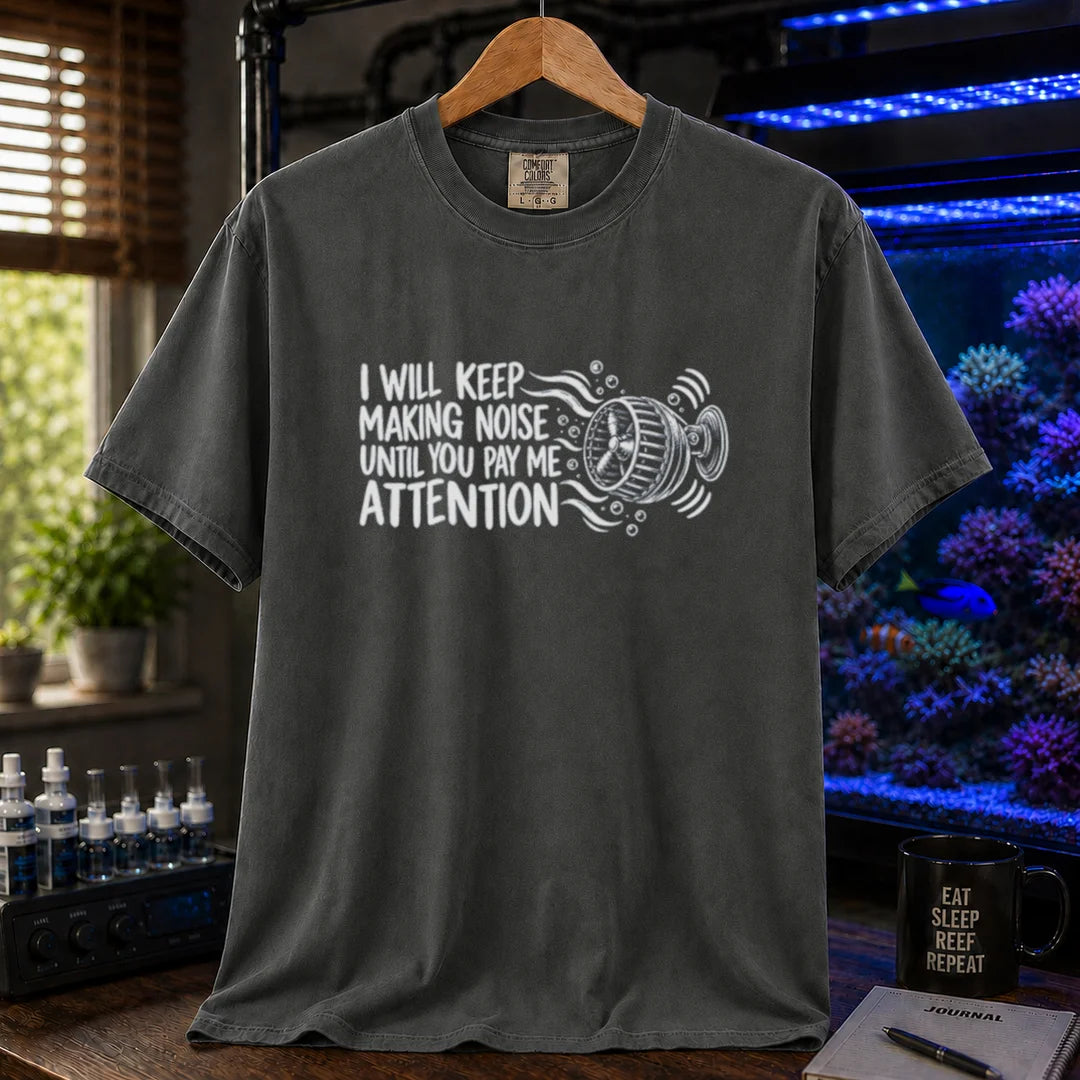 Saltwater aquarium graphic t-shirt featuring distressed typography reading I Will Keep Making Noise Until You Pay Me Attention with an aquarium wavemaker pump illustration on a dark grey shirt