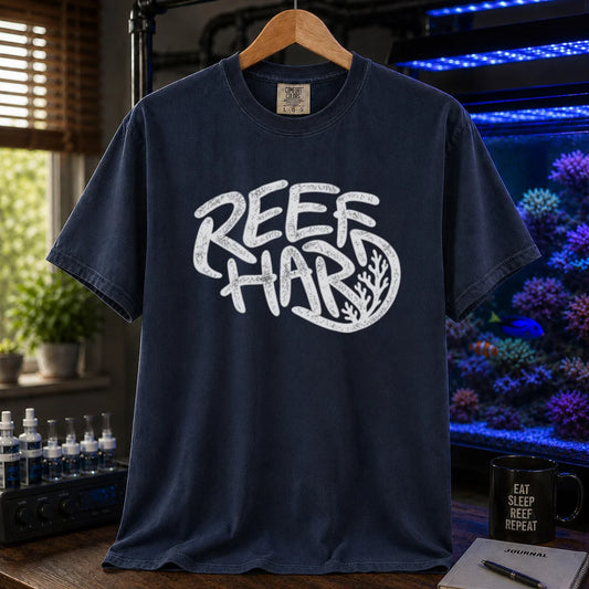 Saltwater aquarium graphic t-shirt featuring distressed graffiti-style bubble typography reading Reef Hard with an integrated coral illustration on a   navy shirt