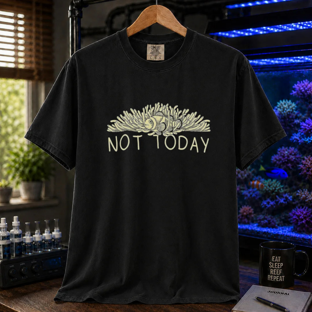 Saltwater aquarium graphic t-shirt featuring an illustration of a clownfish in an anemone with typography reading Not Today in cream on a black shirt