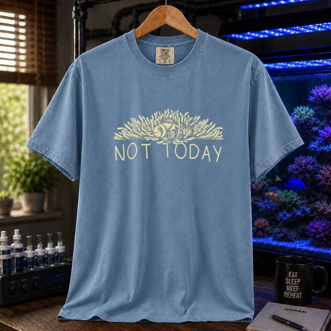 Saltwater aquarium graphic t-shirt featuring an illustration of a clownfish in an anemone with typography reading Not Today in cream on a blue shirt