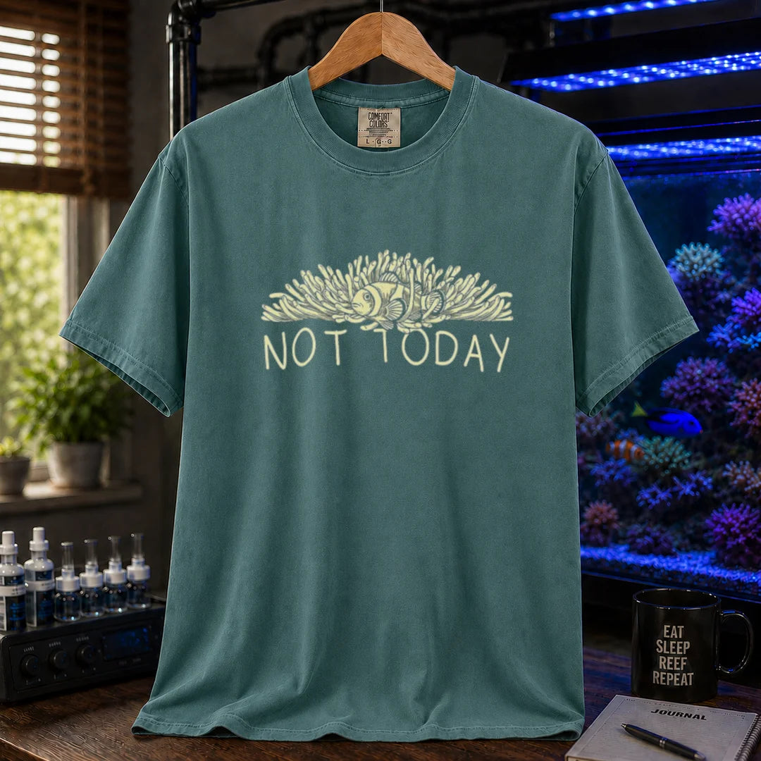 Saltwater aquarium graphic t-shirt featuring an illustration of a clownfish in an anemone with typography reading Not Today in cream on a green shirt