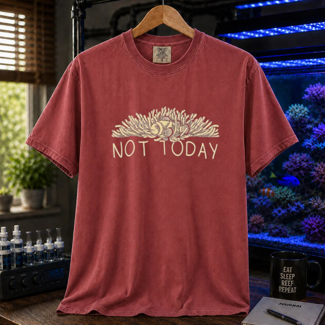 Saltwater aquarium graphic t-shirt featuring an illustration of a clownfish in an anemone with typography reading Not Today in cream on a maroon, red shirt