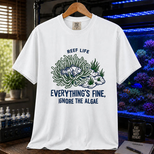 Saltwater aquarium graphic t-shirt featuring dark blue typography reading Reef Life and Everything's Fine Ignore The Algae above an illustration of a fish and algae on a white shirt