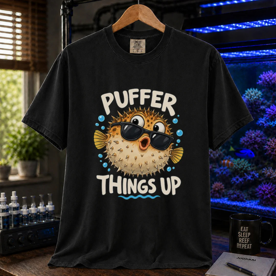 White saltwater aquarium graphic t-shirt featuring typography reading Puffer Things Up framing an illustration of a pufferfish wearing sunglasses on a black shirt