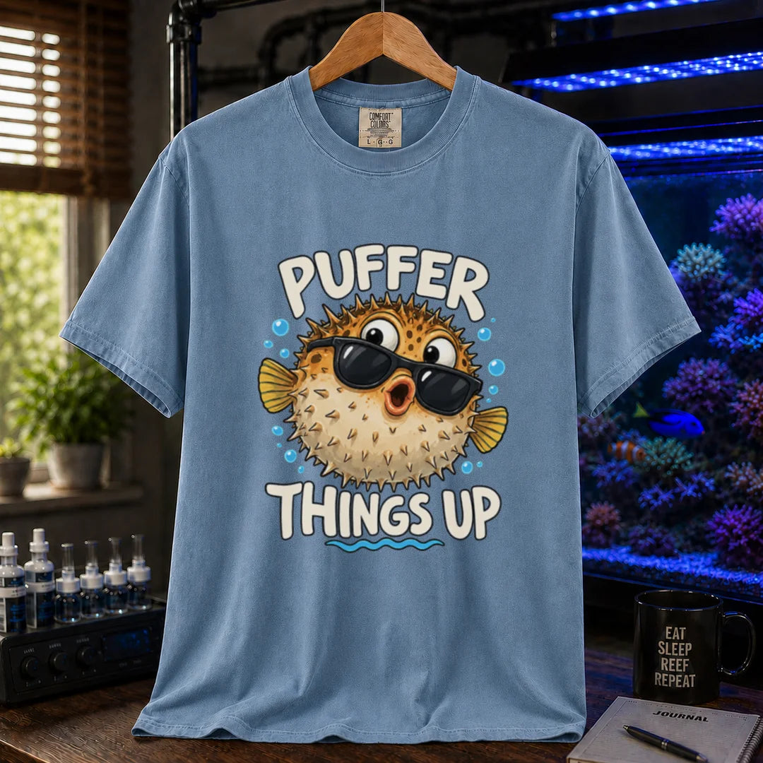White saltwater aquarium graphic t-shirt featuring typography reading Puffer Things Up framing an illustration of a pufferfish wearing sunglasses on a  blue shirt