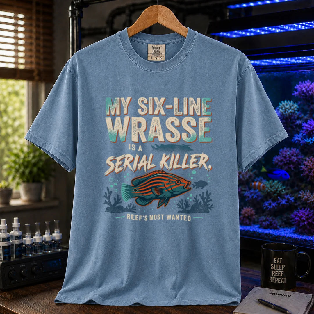 Saltwater aquarium graphic t-shirt featuring distressed typography reading My Six-Line Wrasse Is A Serial Killer with an illustration of a striped wrasse on a blue T-Shirt