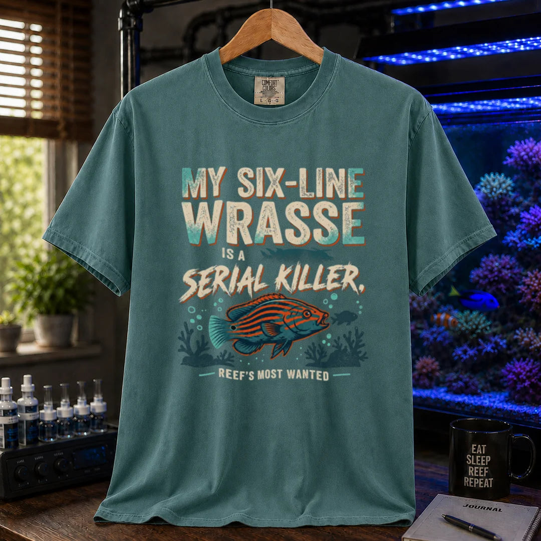 Saltwater aquarium graphic t-shirt featuring distressed typography reading My Six-Line Wrasse Is A Serial Killer with an illustration of a striped wrasse on a green T-Shirt