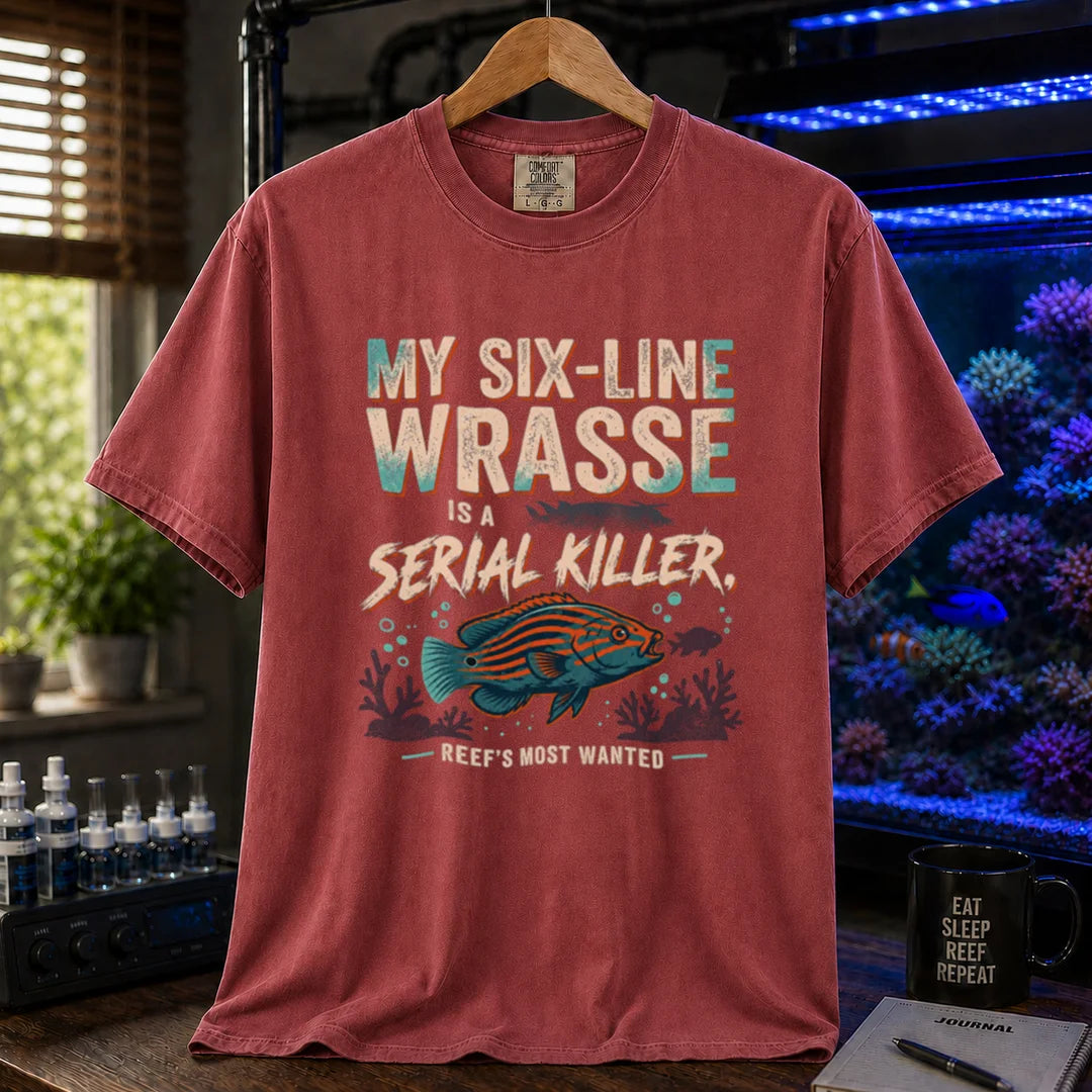 Saltwater aquarium graphic t-shirt featuring distressed typography reading My Six-Line Wrasse Is A Serial Killer with an illustration of a striped wrasse on a maroon, red T-Shirt