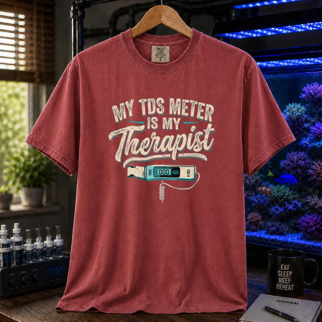 Saltwater aquarium graphic t-shirt featuring distressed typography reading My TDS Meter Is My Therapist with an illustration of a digital TDS meter on a maroon, red T-Shirt