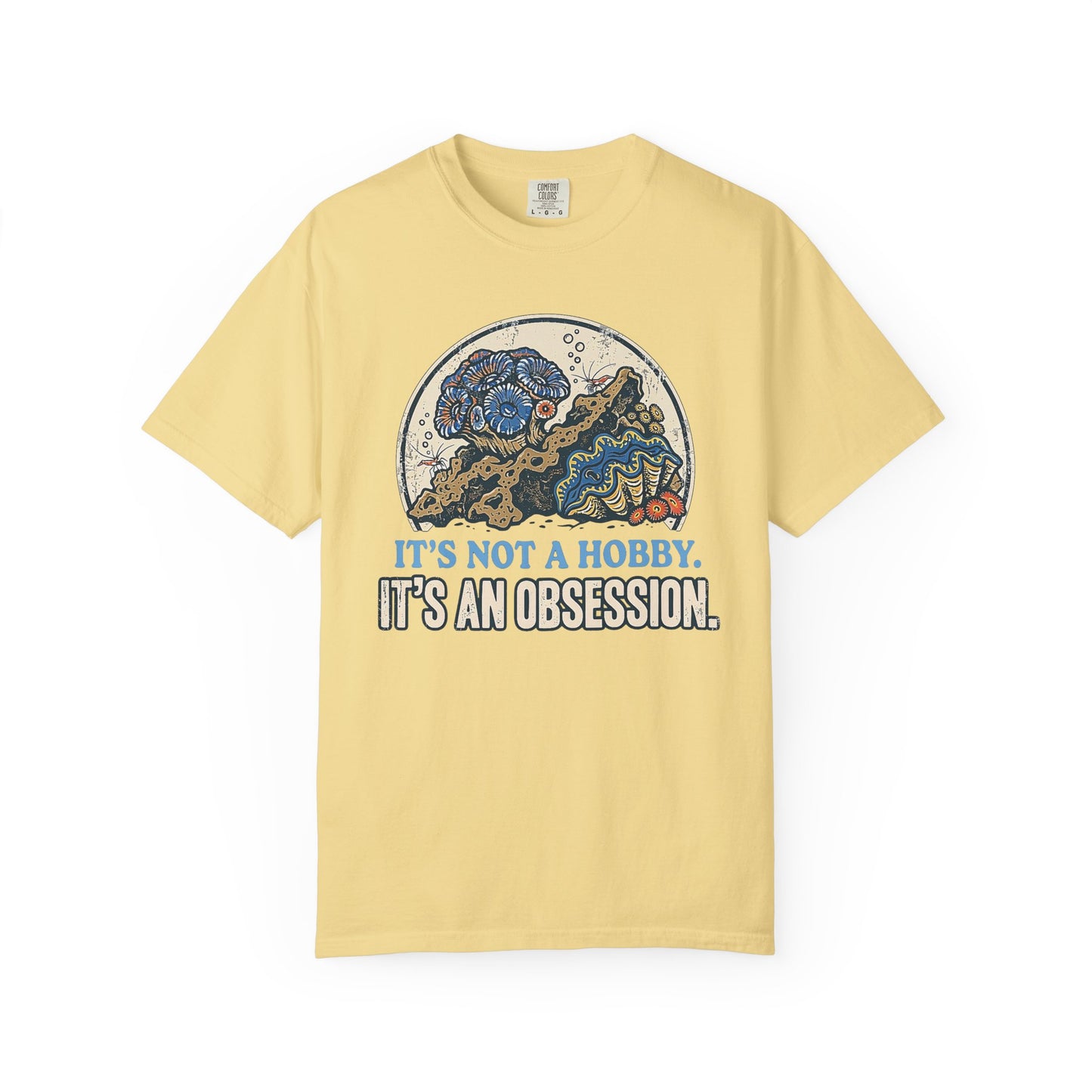 Broke Reefers saltwater aquarium graphic t-shirt featuring a detailed, vintage-style circular illustration of a thriving reef scene with the text: IT'S NOT A HOBBY. IT'S AN OBSESSION., yellow crew neck tee