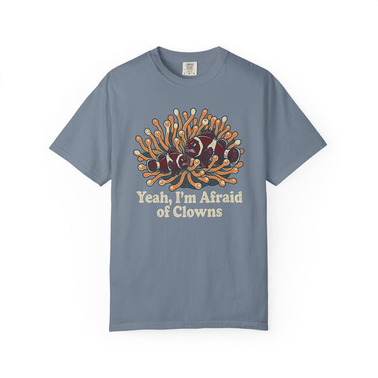 Broke Reefers saltwater aquarium graphic t-shirt featuring a humorous illustration of grumpy clownfish in an anemone with the text: YEAH, I’M AFRAID OF CLOWNS, bluecrew neck tee