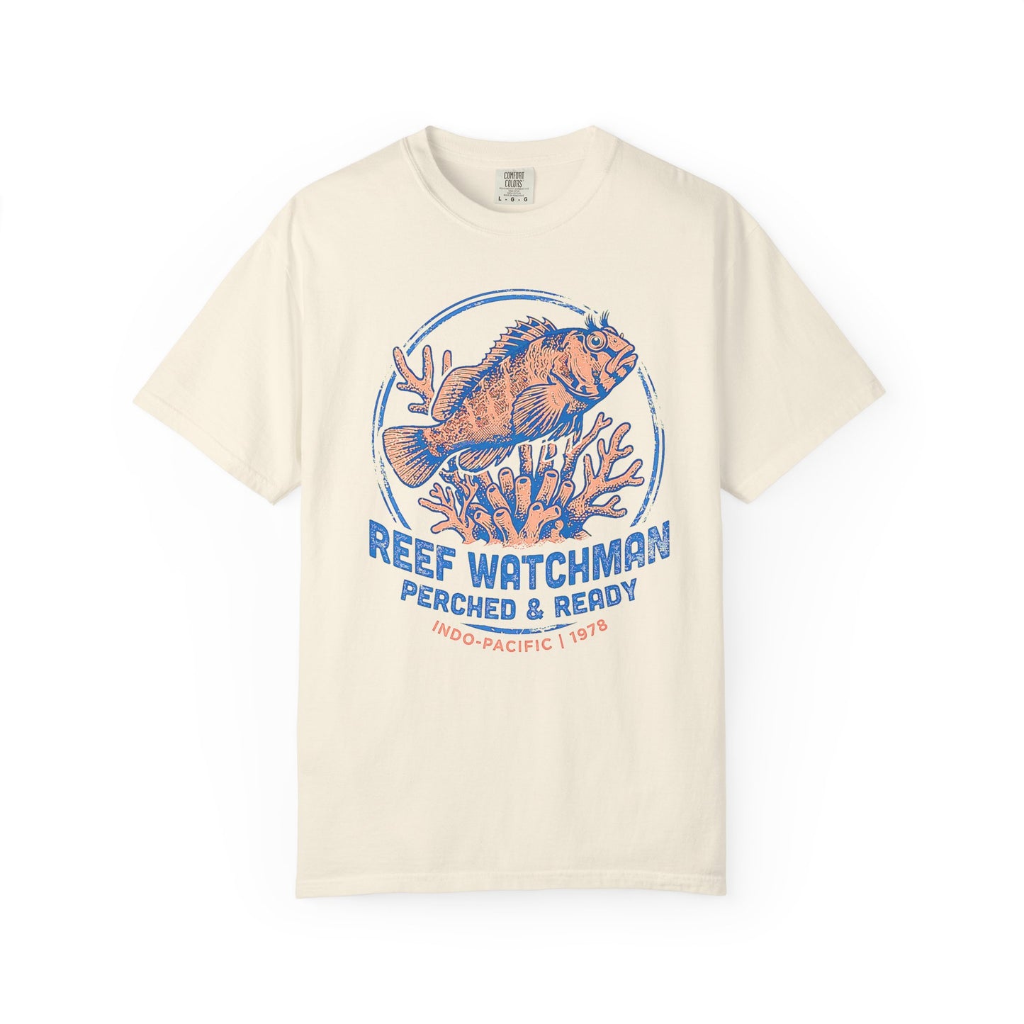 Broke Reefers saltwater aquarium graphic t-shirt featuring a detailed, vintage-style badge illustration of a blenny on coral with the text: REEF WATCHMAN PERCHED & READY INDO-PACIFIC | 1978, beige cream crew neck tee
