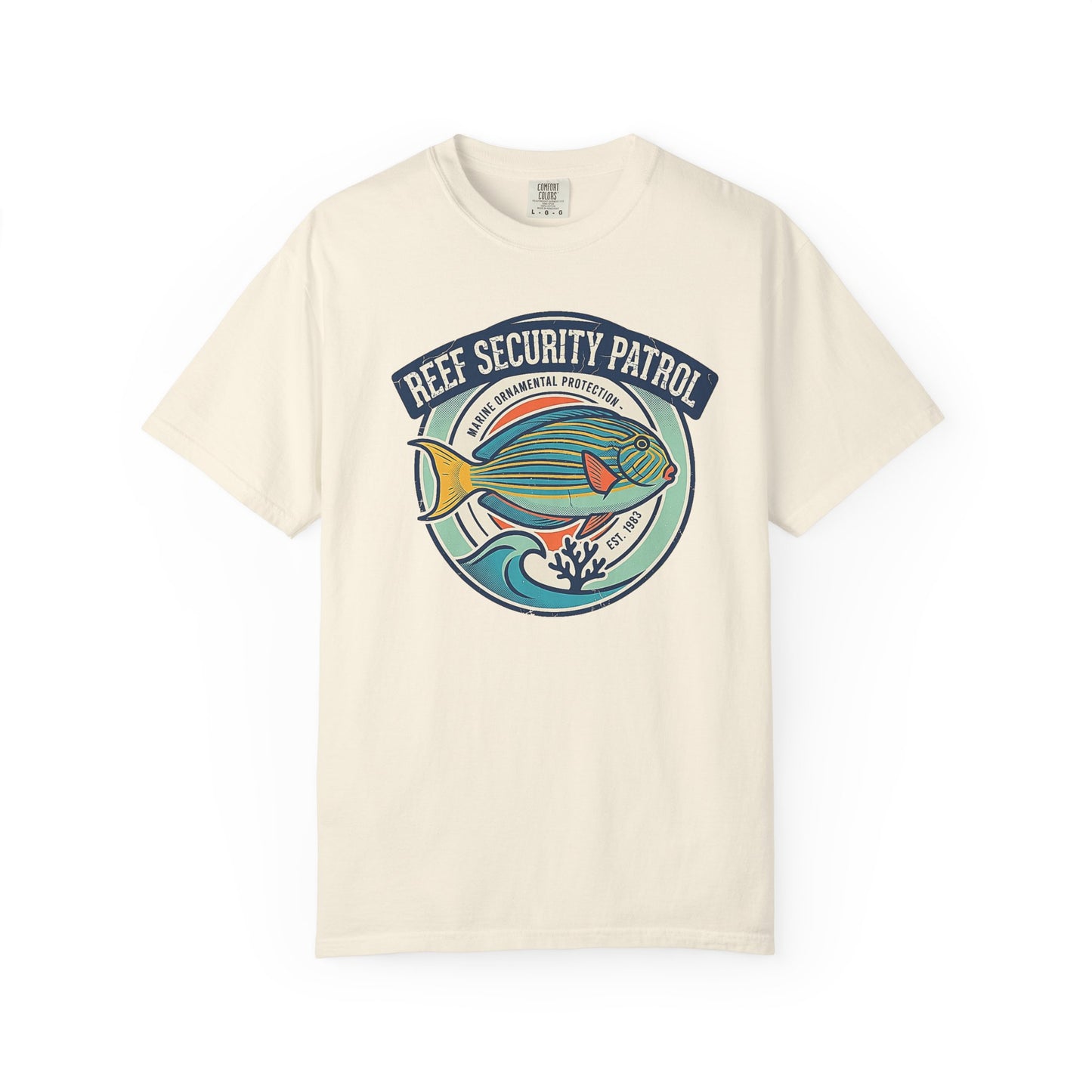 Broke Reefers saltwater aquarium graphic t-shirt featuring a vintage badge-style illustration of a saltwater fish with text reading: REEF SECURITY PATROL, MARINE ORNAMENTAL PROTECTION, EST. 1983, beige cream crew neck tee