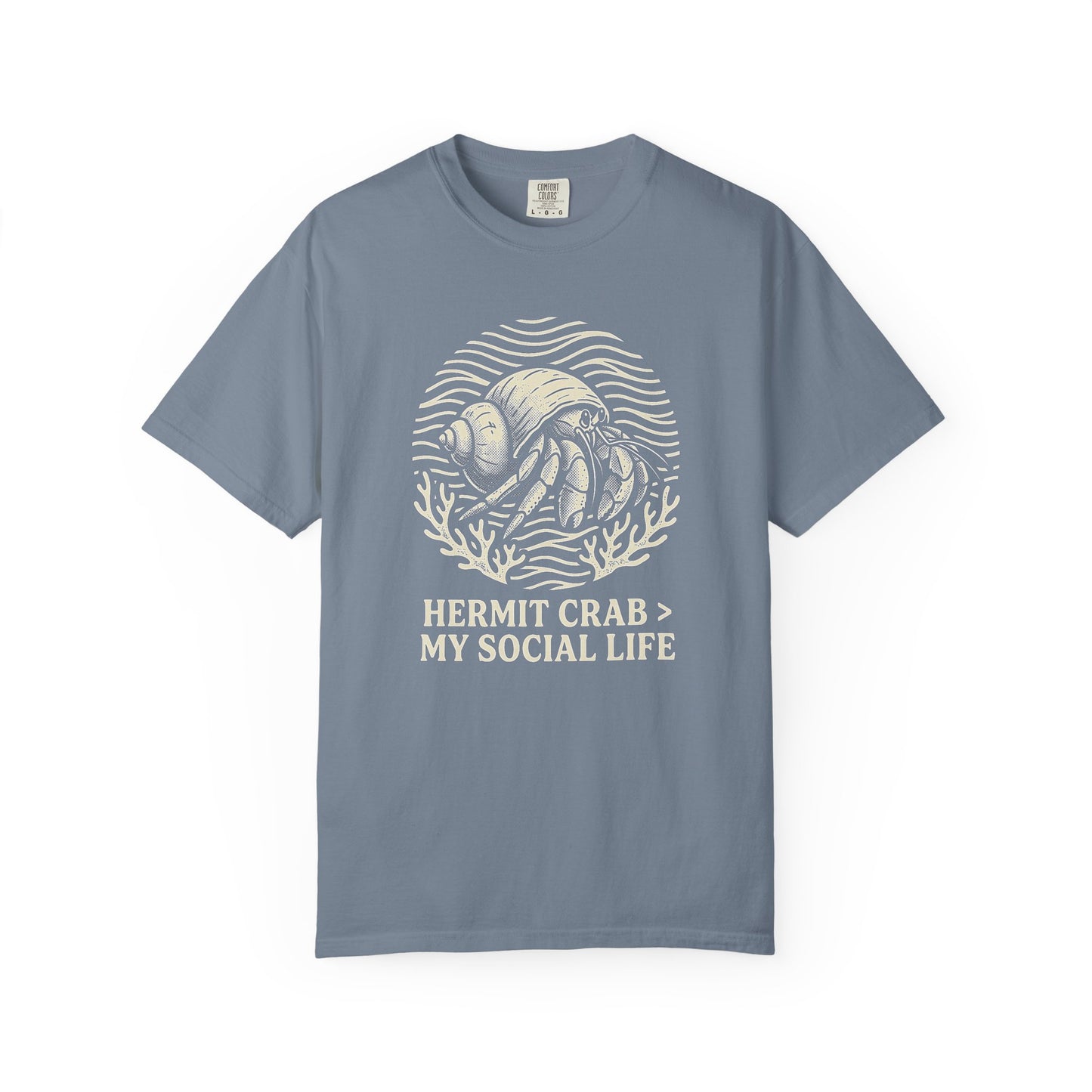 Broke Reefers saltwater aquarium graphic t-shirt featuring a badge illustration of a hermit crab with the text: HERMIT CRAB > MY SOCIAL LIFE, blue crew neck tee
