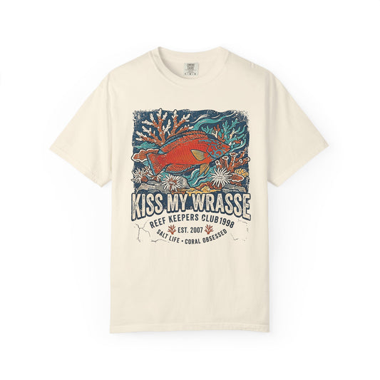 Broke Reefers saltwater aquarium graphic t-shirt featuring a vibrant, vintage-style illustration of a Wrasse on a reef with the text: KISS MY WRASSE, beige cream crew neck tee