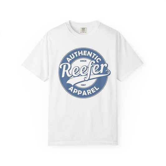 Vintage-inspired graphic t-shirt featuring a circular badge design that reads: AUTHENTIC REEFER APPAREL SINCE 1987, white crew neck tee