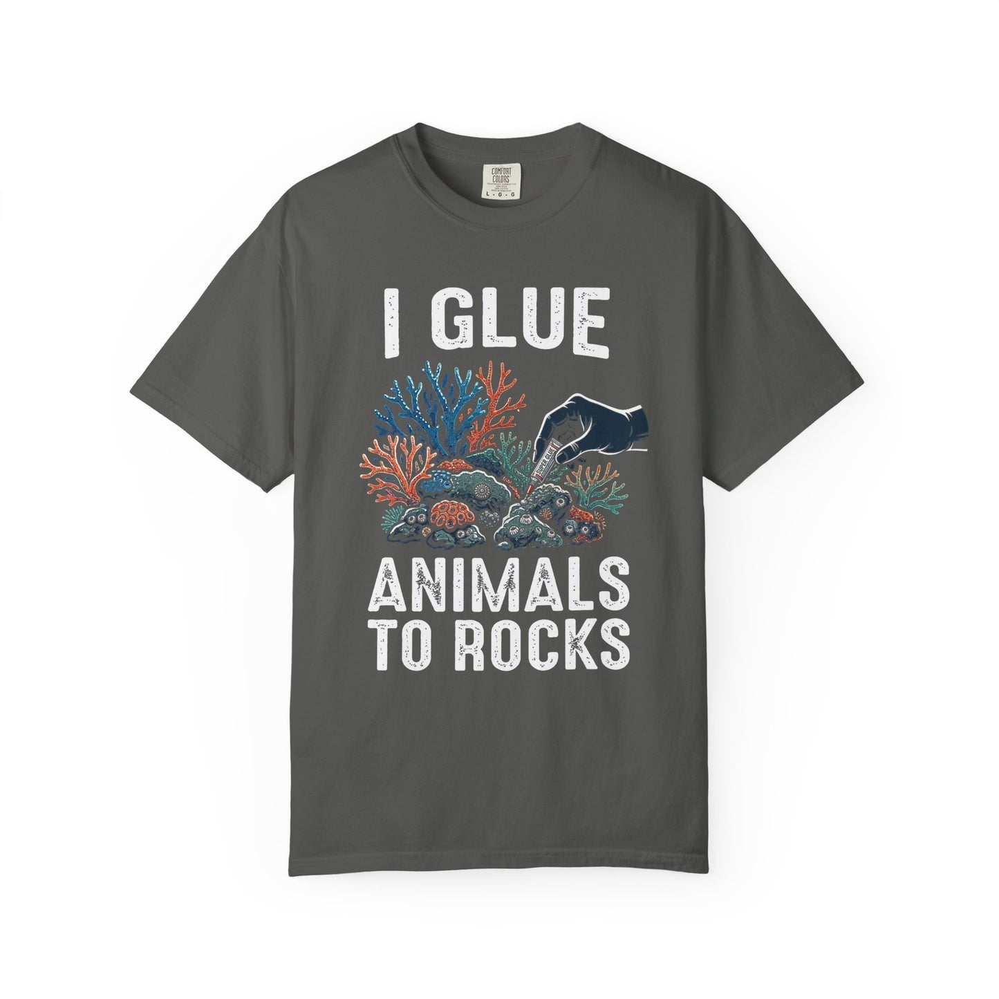 Broke Reefers saltwater aquarium graphic t-shirt featuring a high-contrast illustration of a gloved hand applying super glue to coral, with bold text: I GLUE ANIMALS TO ROCKS, dark khaki crew neck tee