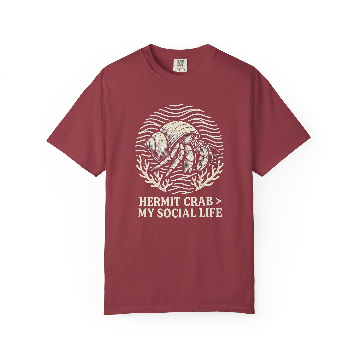 Broke Reefers saltwater aquarium graphic t-shirt featuring a badge illustration of a hermit crab with the text: HERMIT CRAB > MY SOCIAL LIFE, maroon crew neck tee