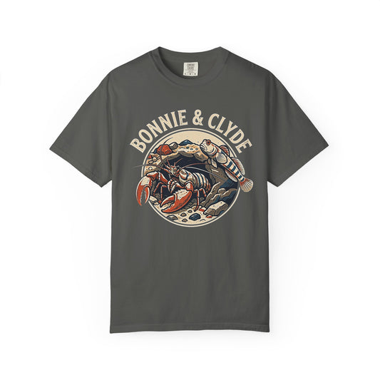Broke Reefers saltwater aquarium graphic t-shirt featuring a circular badge illustration of a pistol shrimp and a goby with the text: BONNIE & CLYDE, dark khaki crew neck tee