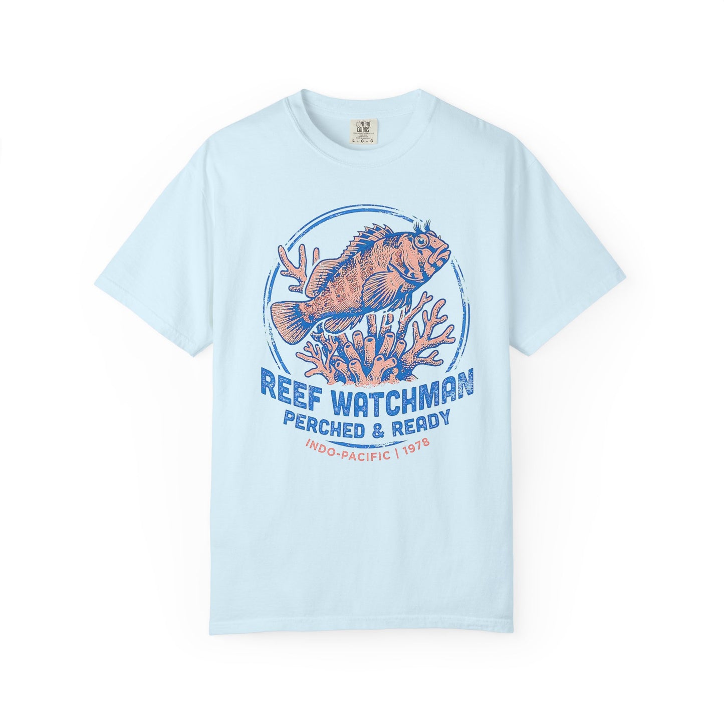 Broke Reefers saltwater aquarium graphic t-shirt featuring a detailed, vintage-style badge illustration of a blenny on coral with the text: REEF WATCHMAN PERCHED & READY INDO-PACIFIC | 1978, light blue crew neck tee