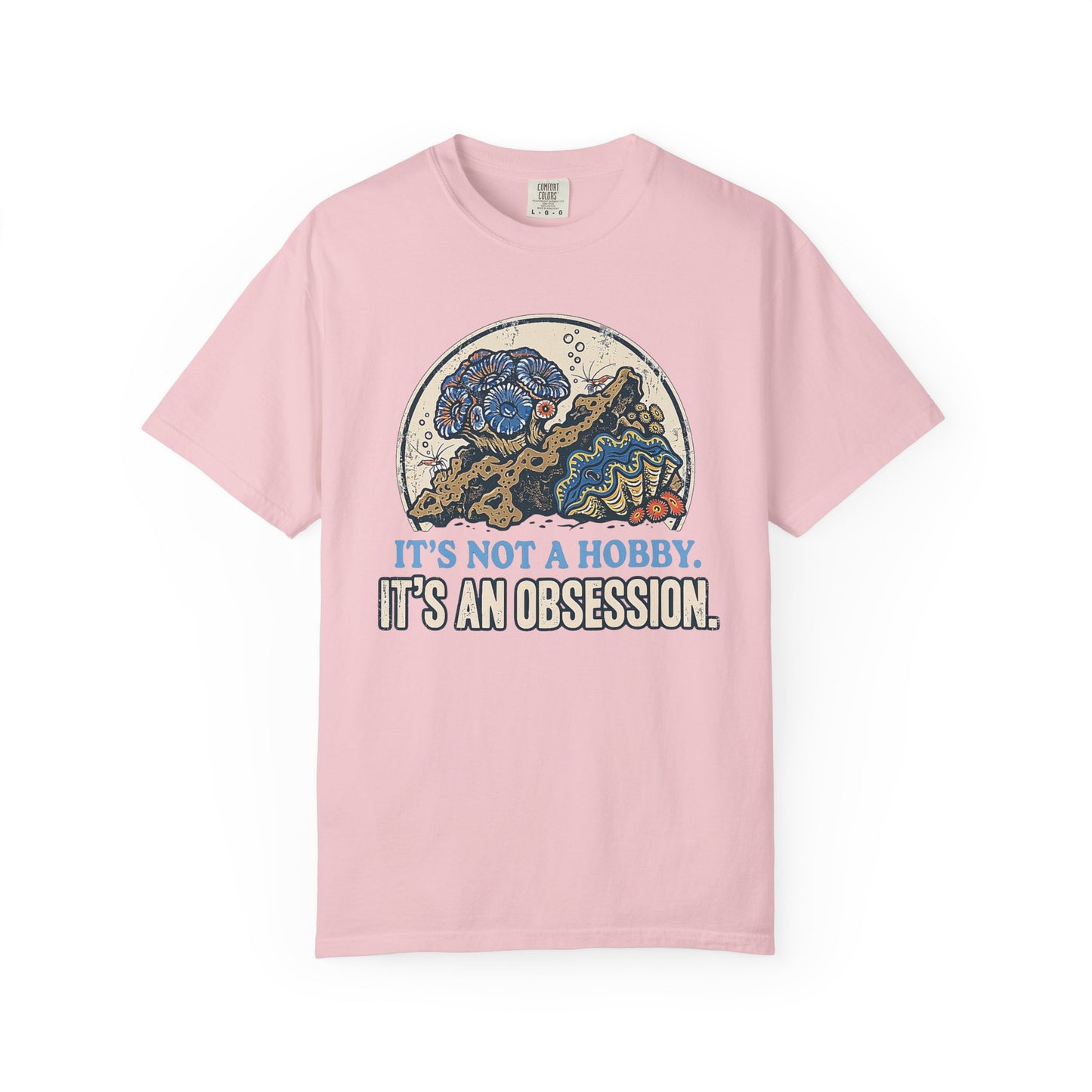 Broke Reefers saltwater aquarium graphic t-shirt featuring a detailed, vintage-style circular illustration of a thriving reef scene with the text: IT'S NOT A HOBBY. IT'S AN OBSESSION., pink crew neck tee