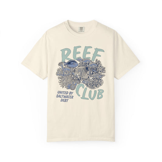 Broke Reefers graphic t-shirt featuring a detailed reef illustration with the text: REEF CLUB, UNITED BY SALTWATER DEBT, beige cream crew neck tee