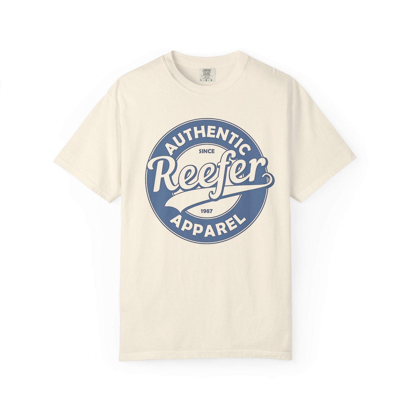 Vintage-inspired graphic t-shirt featuring a circular badge design that reads: AUTHENTIC REEFER APPAREL SINCE 1987, beige cream crew neck tee