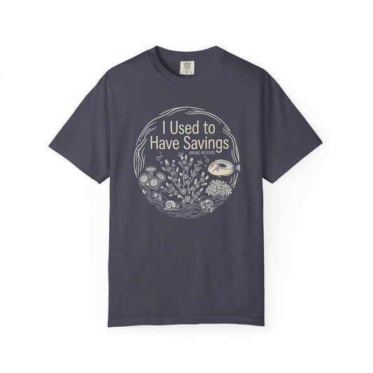 Broke Reefers graphic t-shirt featuring a circular line-art illustration of reef life and the text: I USED TO HAVE SAVINGS, navy crew neck tee