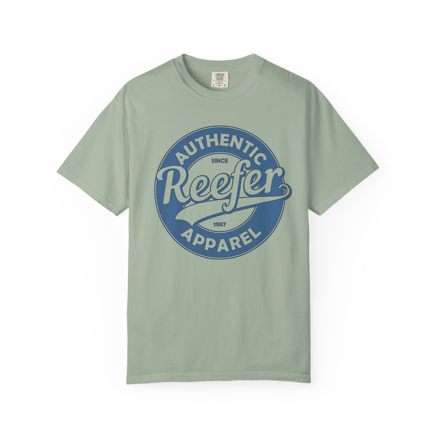 Vintage-inspired graphic t-shirt featuring a circular badge design that reads: AUTHENTIC REEFER APPAREL SINCE 1987, green crew neck tee