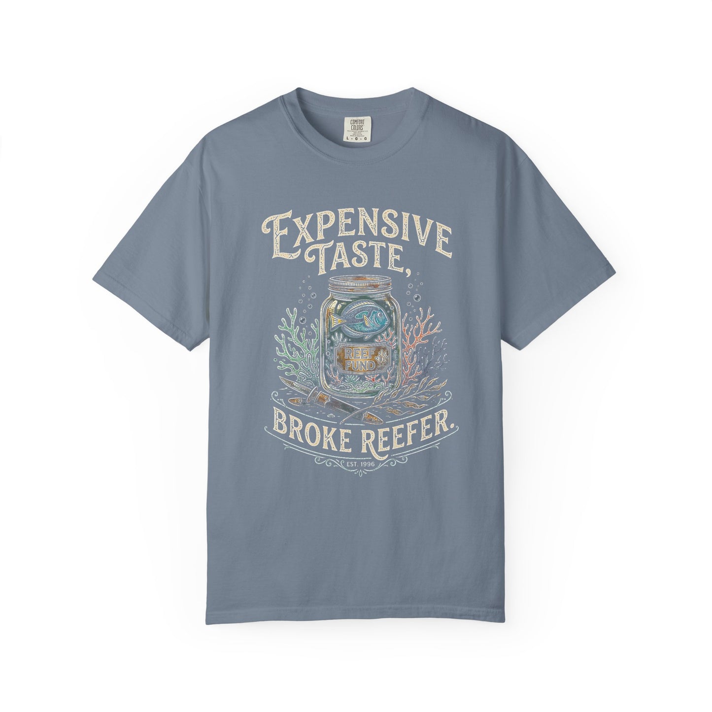 Broke Reefers saltwater aquarium graphic t-shirt featuring a detailed illustration of a fish in a jar with the text: EXPENSIVE TASTE, BROKE REEFER. EST. 1996, blue crew neck tee