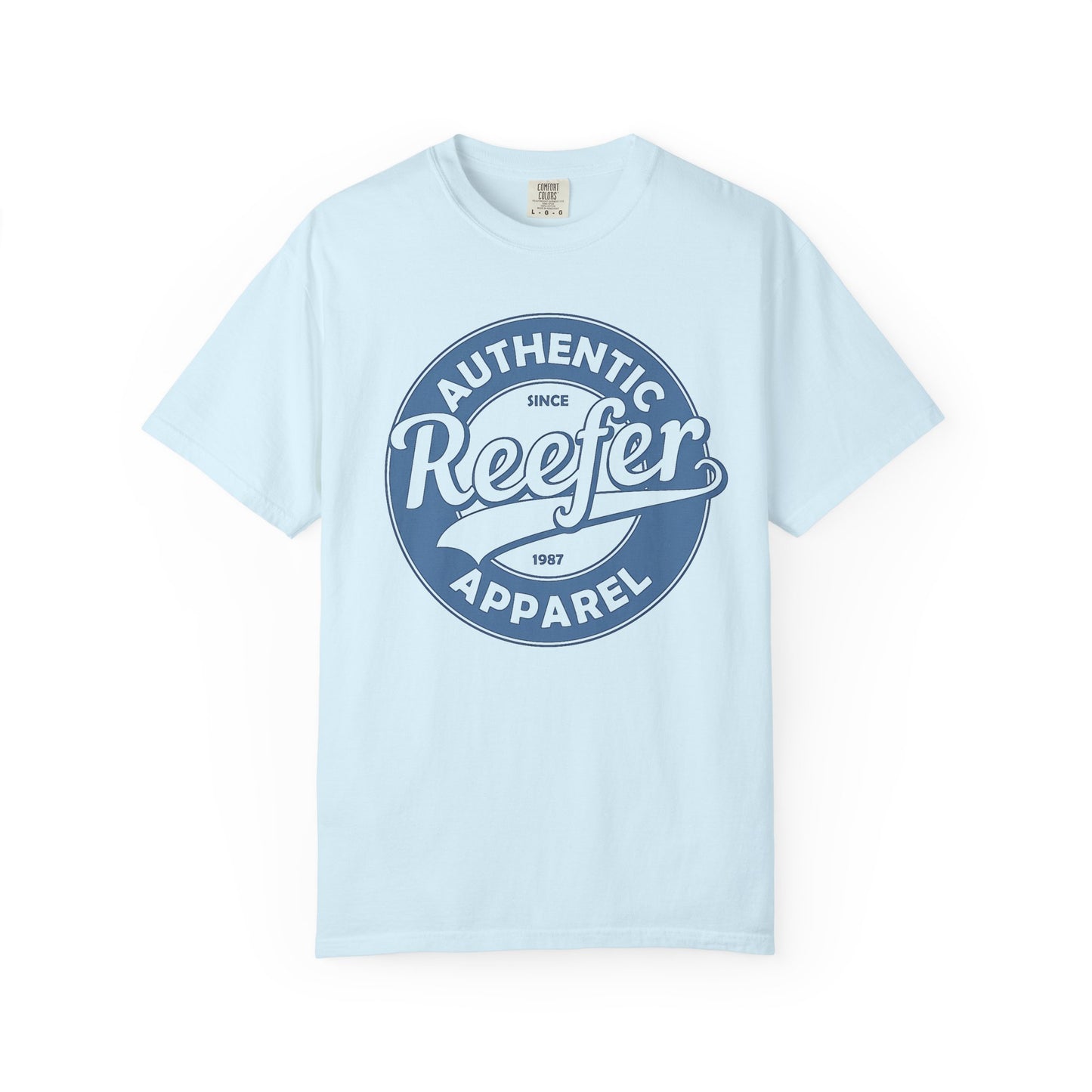 Vintage-inspired graphic t-shirt featuring a circular badge design that reads: AUTHENTIC REEFER APPAREL SINCE 1987, light blue crew neck tee