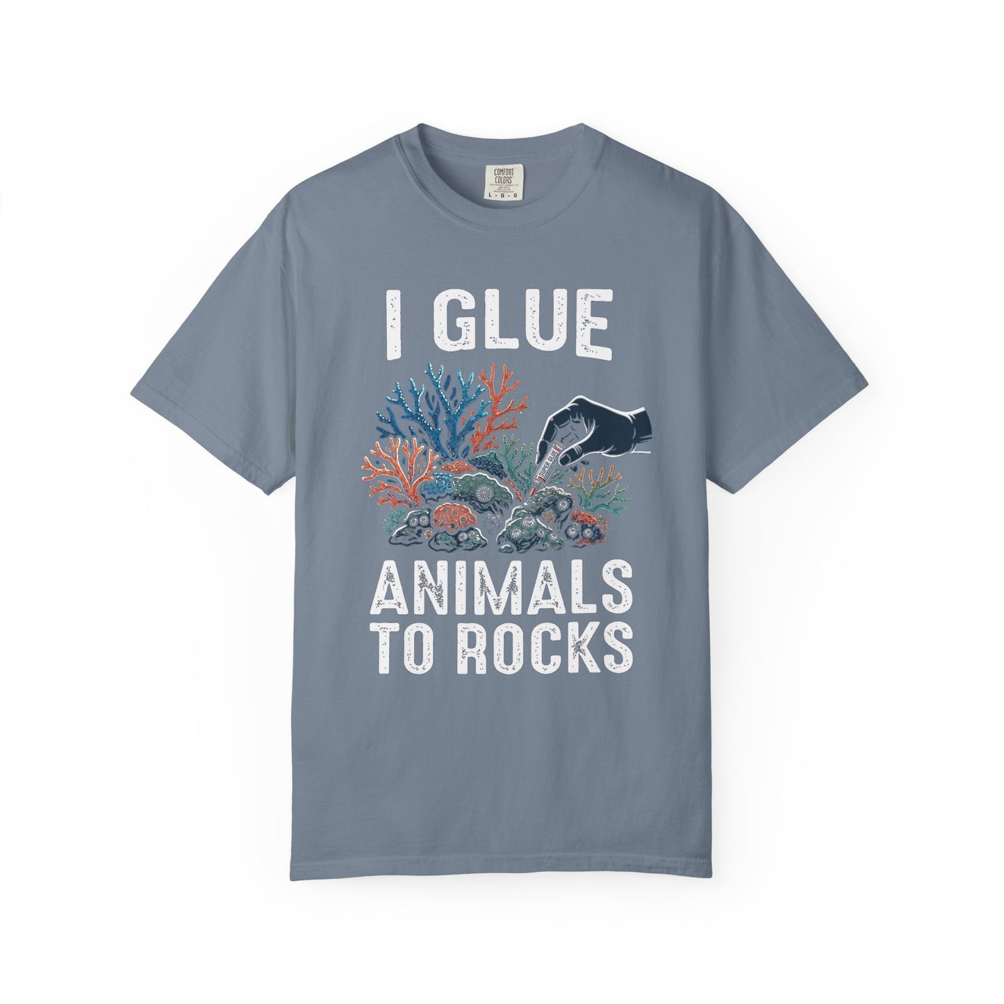 Broke Reefers saltwater aquarium graphic t-shirt featuring a high-contrast illustration of a gloved hand applying super glue to coral, with bold text: I GLUE ANIMALS TO ROCKS, blue crew neck tee