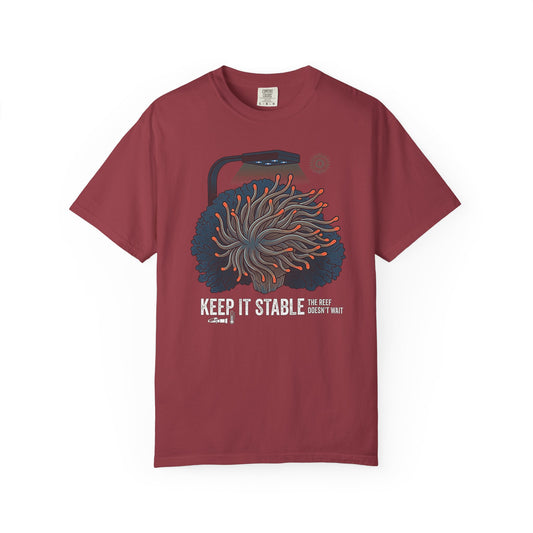 Broke Reefers graphic t-shirt featuring an illustration of an anemone under aquarium lighting with icons for a refractometer and thermometer, and the text: KEEP IT STABLE THE REEF DOESN'T WAIT, maroon crew neck tee