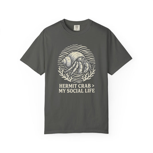 Broke Reefers saltwater aquarium graphic t-shirt featuring a badge illustration of a hermit crab with the text: HERMIT CRAB > MY SOCIAL LIFE, dark khaki crew neck tee