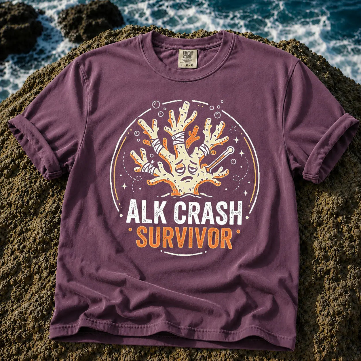 Broke Reefers saltwater aquarium graphic t-shirt featuring an expressive, bandaged coral illustration with the text: ALK CRASH SURVIVOR, purple crew neck tee