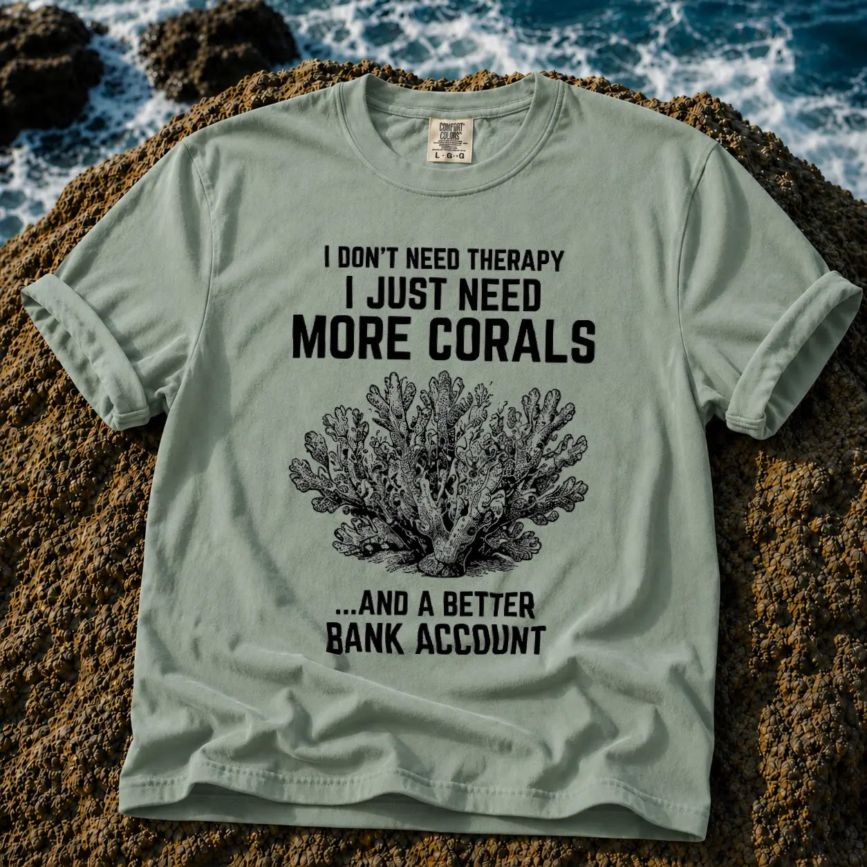 Broke Reefers saltwater aquarium graphic t-shirt featuring a detailed vintage-style coral illustration with the text: I DON'T NEED THERAPY, I JUST NEED MORE CORALS, ...AND A BETTER BANK ACCOUNT, light green crew neck tee