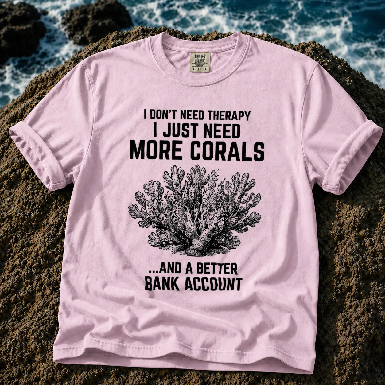 Broke Reefers saltwater aquarium graphic t-shirt featuring a detailed vintage-style coral illustration with the text: I DON'T NEED THERAPY, I JUST NEED MORE CORALS, ...AND A BETTER BANK ACCOUNT, pink crew neck tee