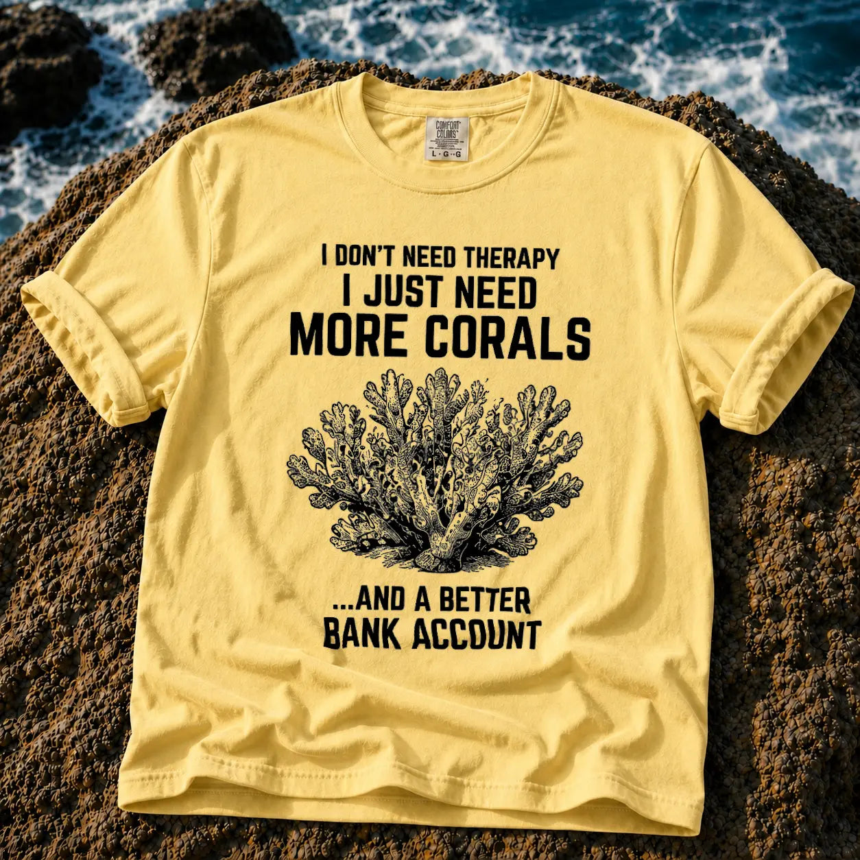 Broke Reefers saltwater aquarium graphic t-shirt featuring a detailed vintage-style coral illustration with the text: I DON'T NEED THERAPY, I JUST NEED MORE CORALS, ...AND A BETTER BANK ACCOUNT, butter crew neck tee